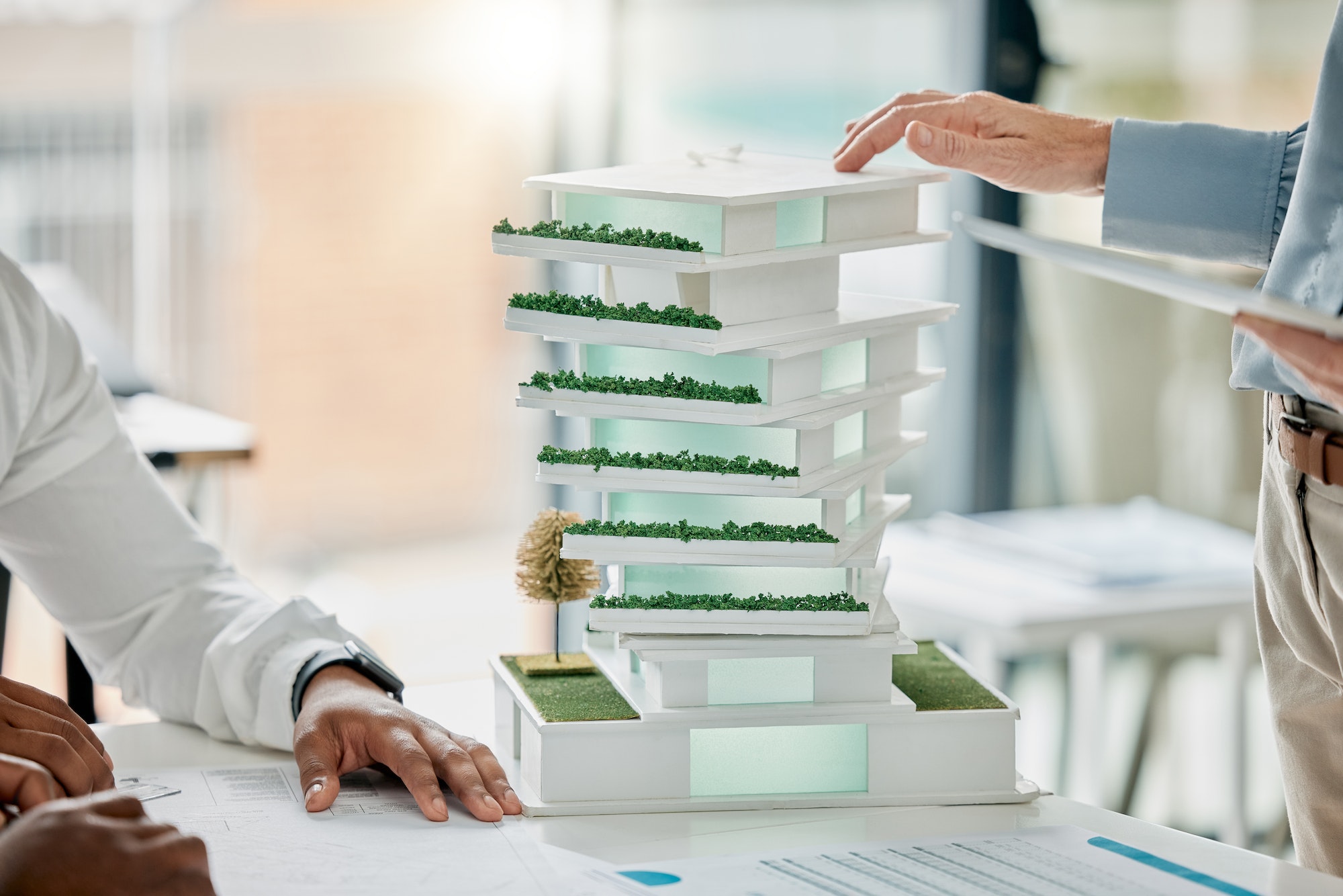 Building model, diversity and hands of architect working on real estate development, architecture e